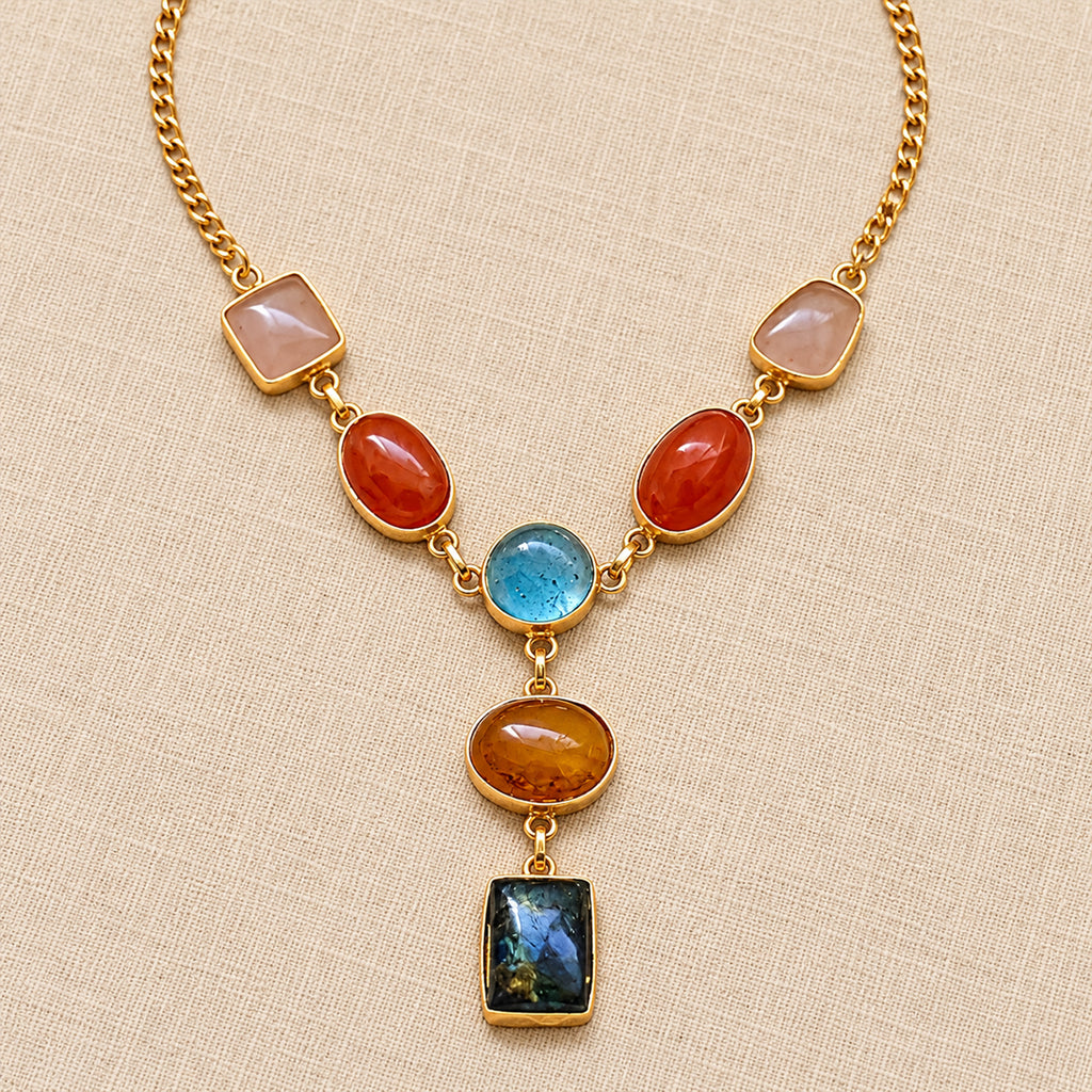 Gold-tone pendant necklace with rose quartz, carnelian, blue chalcedony, citrine, and labradorite gemstones